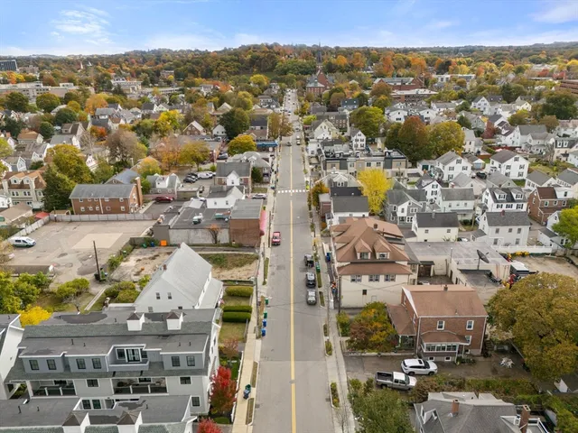 an aerial view of residential building with parking