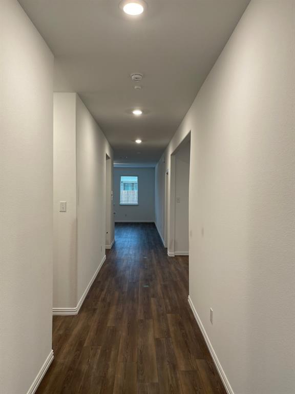 3700 Milkweed Road McKinney, TX 75071 - Photo 7 of 18 Hallway with wood-finish flooring, white baseboards, recessed ceiling lighting, and light-toned walls