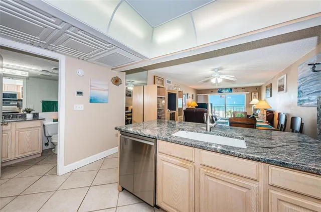 a kitchen with stainless steel appliances granite countertop a sink and cabinets