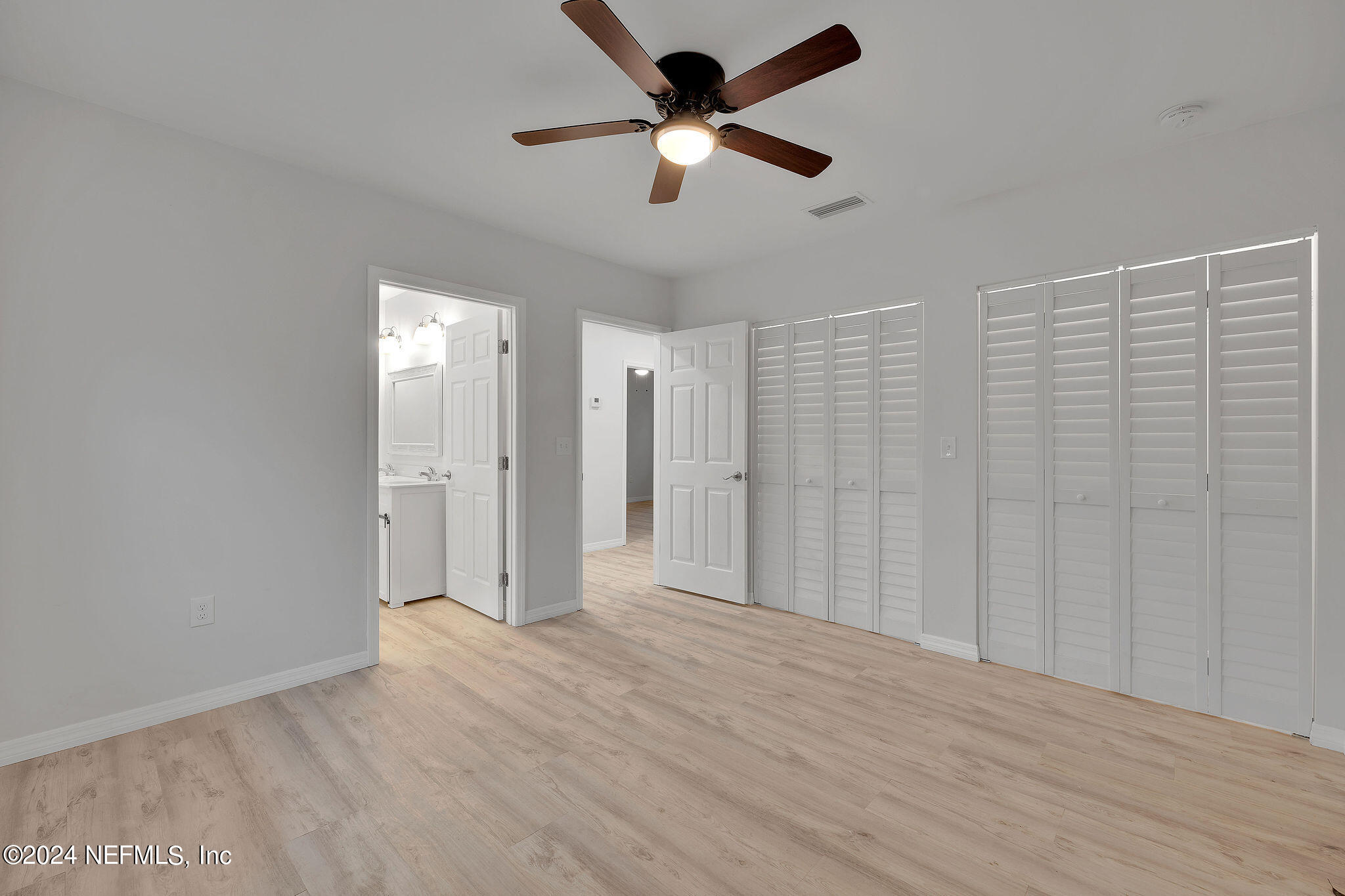 7519 Birdies Road Jacksonville, FL 32256 - Photo 21 of 24 a view of empty room with wooden floor and fan