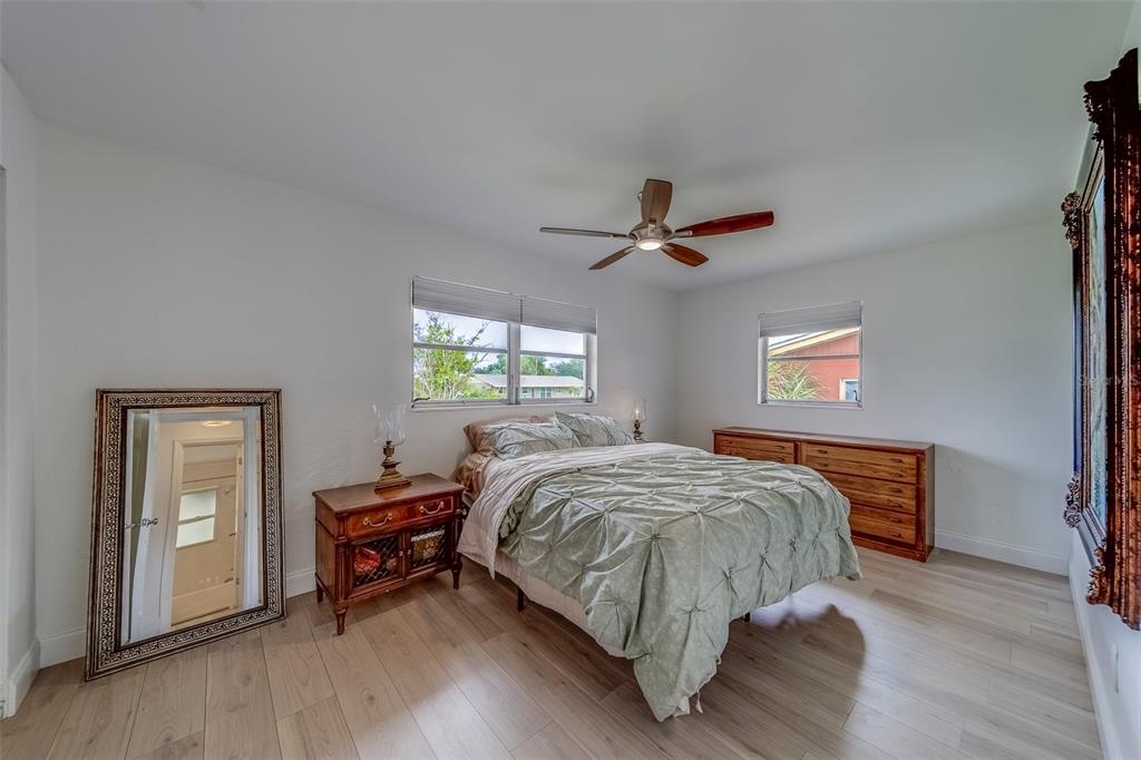 11424 79th Avenue Seminole, FL 33772 - Photo 24 of 62 a bedroom with a bed and a window