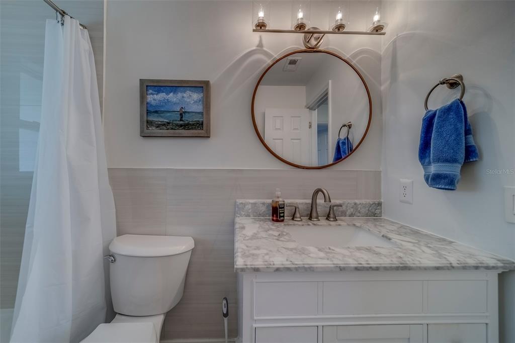11424 79th Avenue Seminole, FL 33772 - Photo 27 of 62 a bathroom with a toilet and a sink