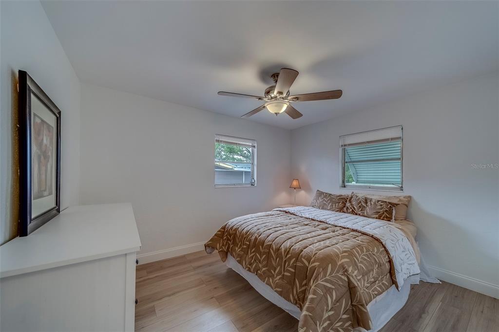 11424 79th Avenue Seminole, FL 33772 - Photo 28 of 62 a bedroom with a bed and a window