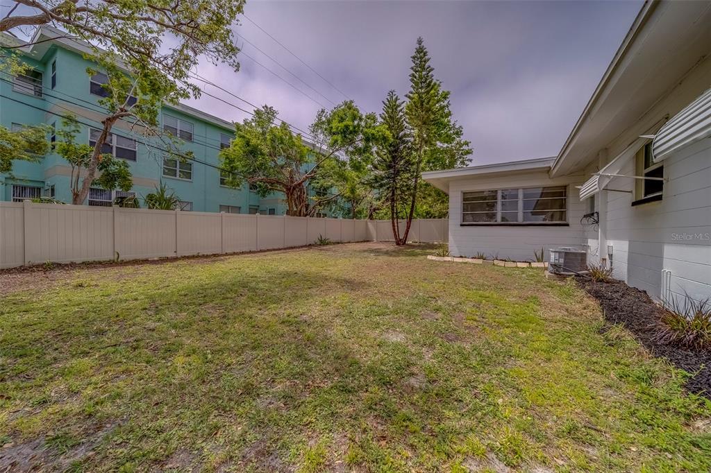 11424 79th Avenue Seminole, FL 33772 - Photo 44 of 62 a view of a backyard with a tree