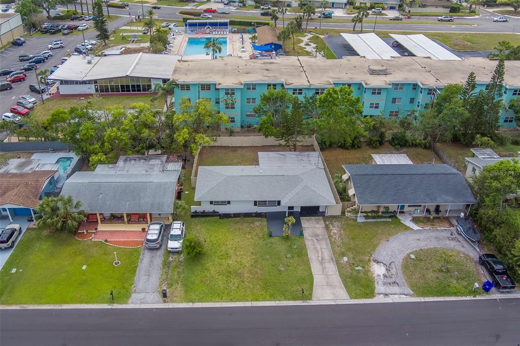 11424 79th Avenue Seminole, FL 33772 - Photo 48 of 62 an aerial view of house with yard swimming pool and outdoor seating