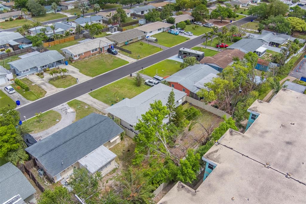 11424 79th Avenue Seminole, FL 33772 - Photo 51 of 62 an aerial view of residential houses with outdoor space
