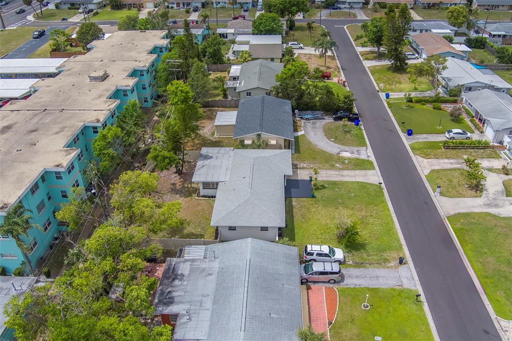 11424 79th Avenue Seminole, FL 33772 - Photo 54 of 62 an aerial view of residential houses with outdoor space