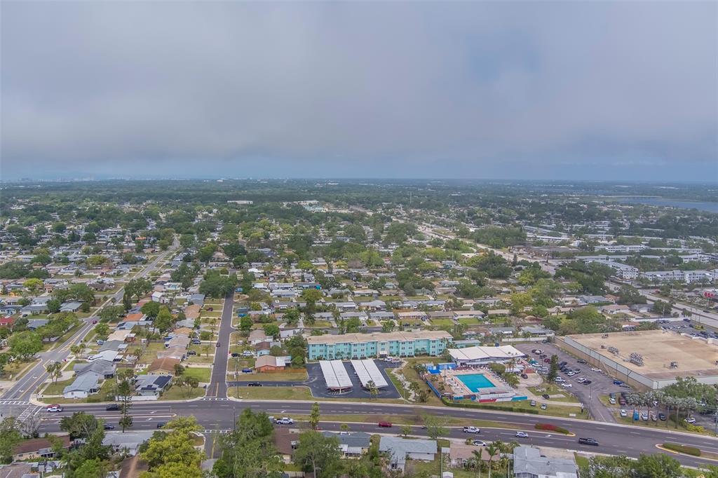 11424 79th Avenue Seminole, FL 33772 - Photo 58 of 62 an aerial view of residential building and lake view