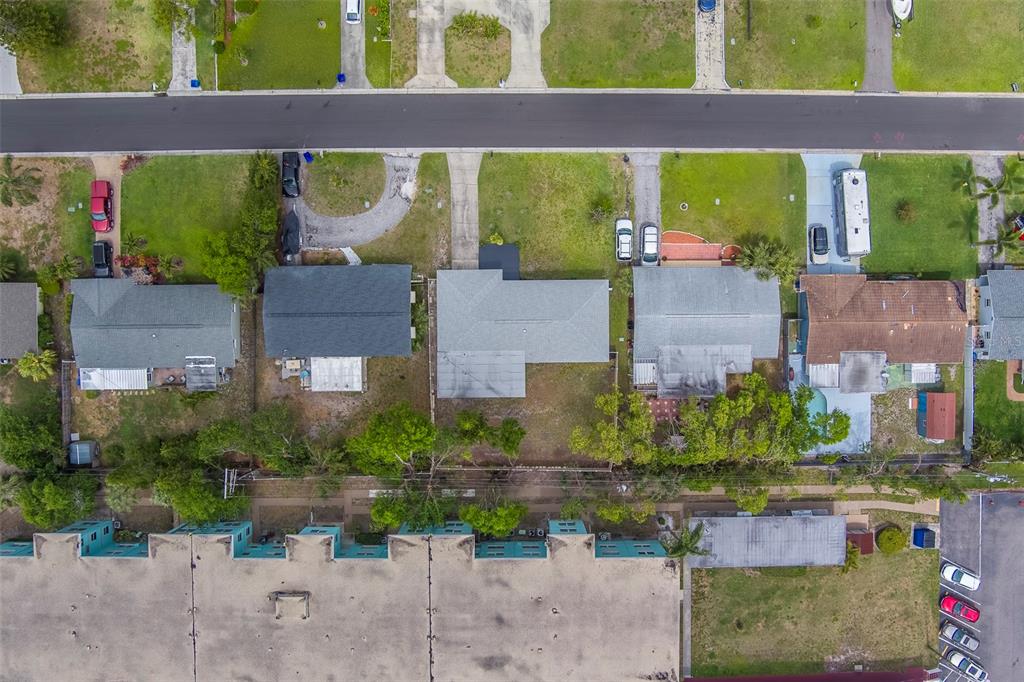 11424 79th Avenue Seminole, FL 33772 - Photo 61 of 62 an aerial view of a building with garden space and outdoor seating
