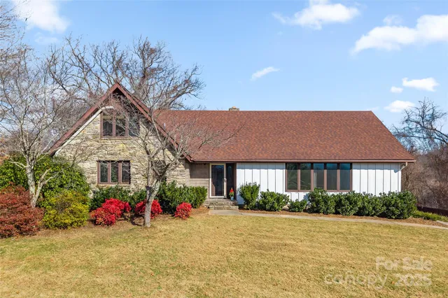 a front view of house with an outdoor space and seating