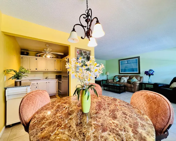 a view of a livingroom with furniture and a chandelier