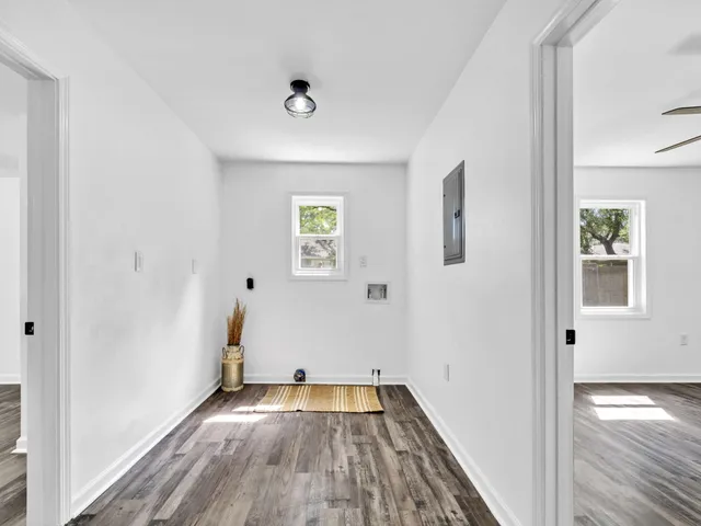 wooden floor in an empty room with a window