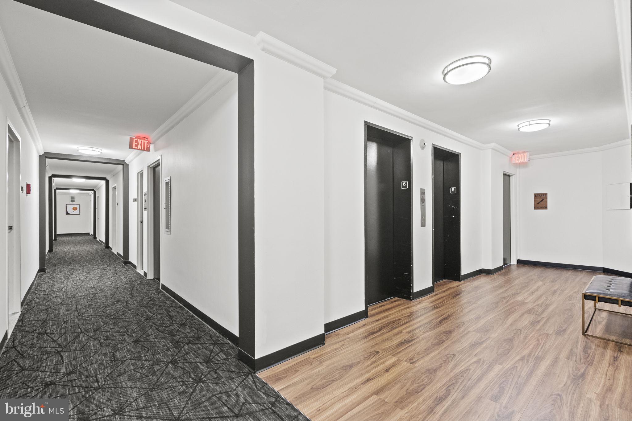 2030 F Street Northwest, Unit 606 Washington, DC 20006 - Photo 12 of 14 a view of a hallway with wooden floor and closet