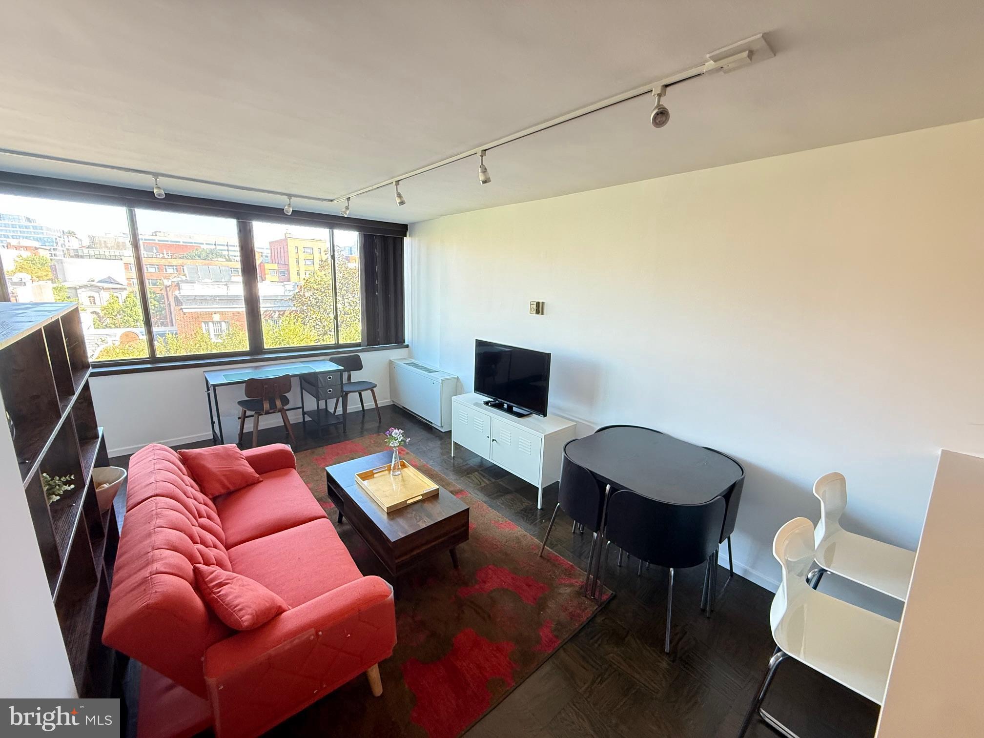 2030 F Street Northwest, Unit 606 Washington, DC 20006 - Photo 2 of 14 a room with furniture or outdoor view and a window