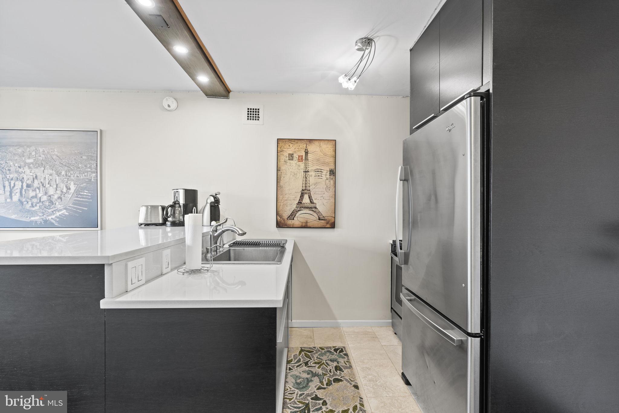 2030 F Street Northwest, Unit 606 Washington, DC 20006 - Photo 6 of 14 a bathroom with a sink and a mirror