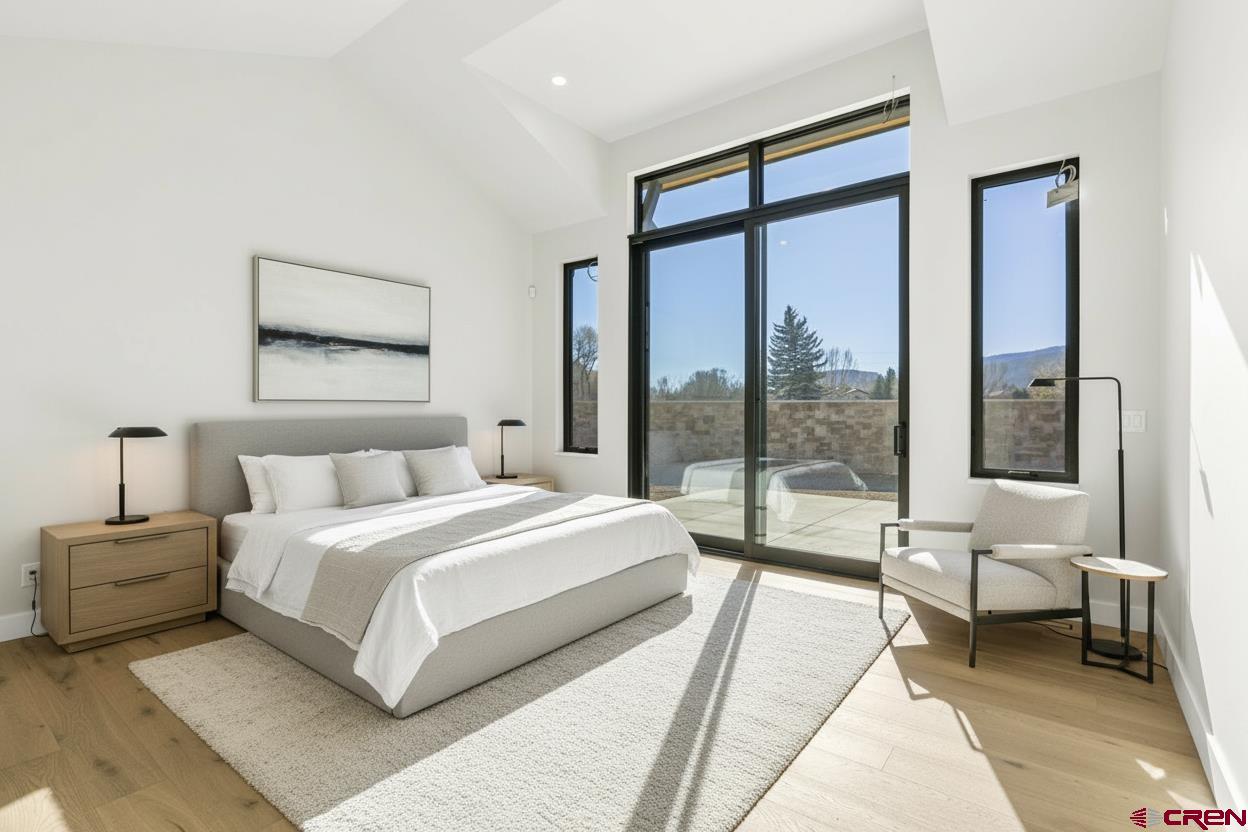 102 Elkview Court Durango, CO 81301 - Photo 24 of 45 a bedroom with a large bed and a large window