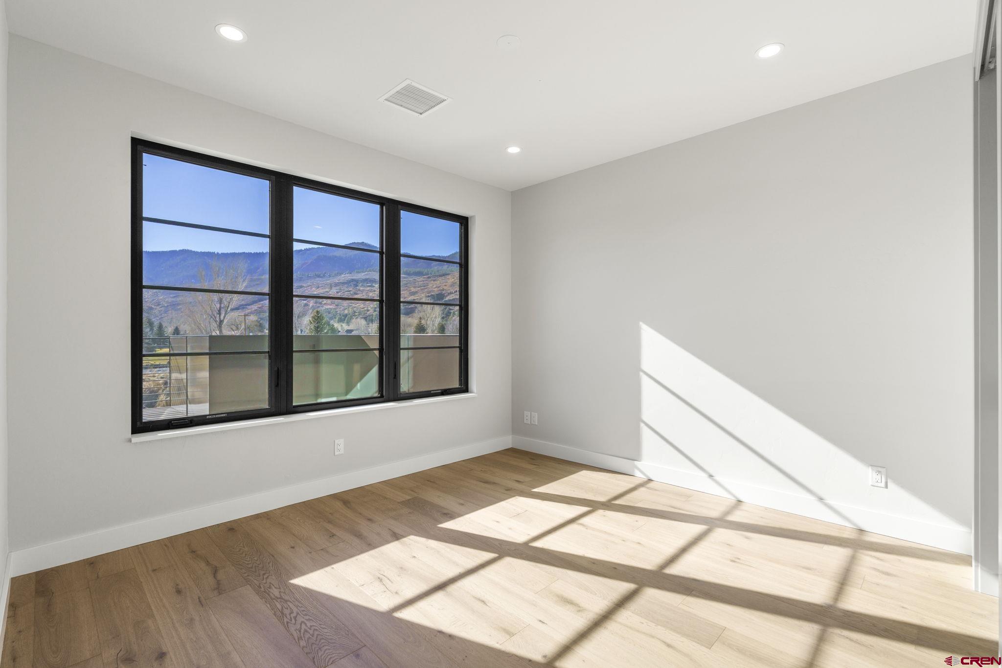 102 Elkview Court Durango, CO 81301 - Photo 27 of 45 a view of an empty room with a window