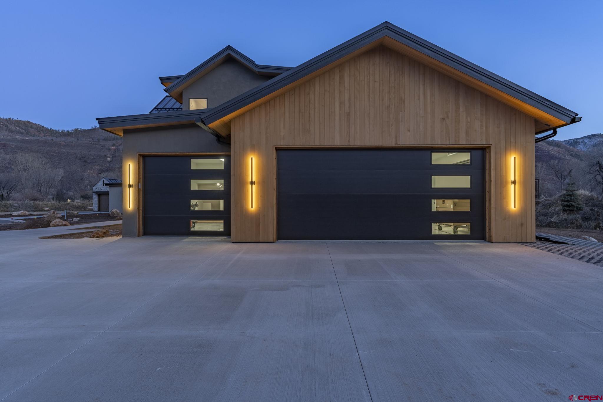 102 Elkview Court Durango, CO 81301 - Photo 3 of 45 a front view of a house with a yard and garage