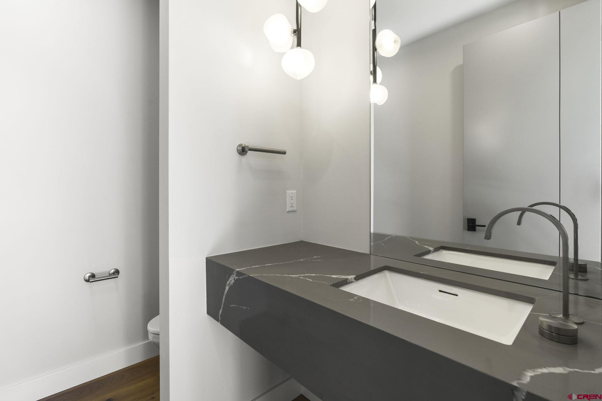 102 Elkview Court Durango, CO 81301 - Photo 32 of 45 a bathroom with a sink and a mirror