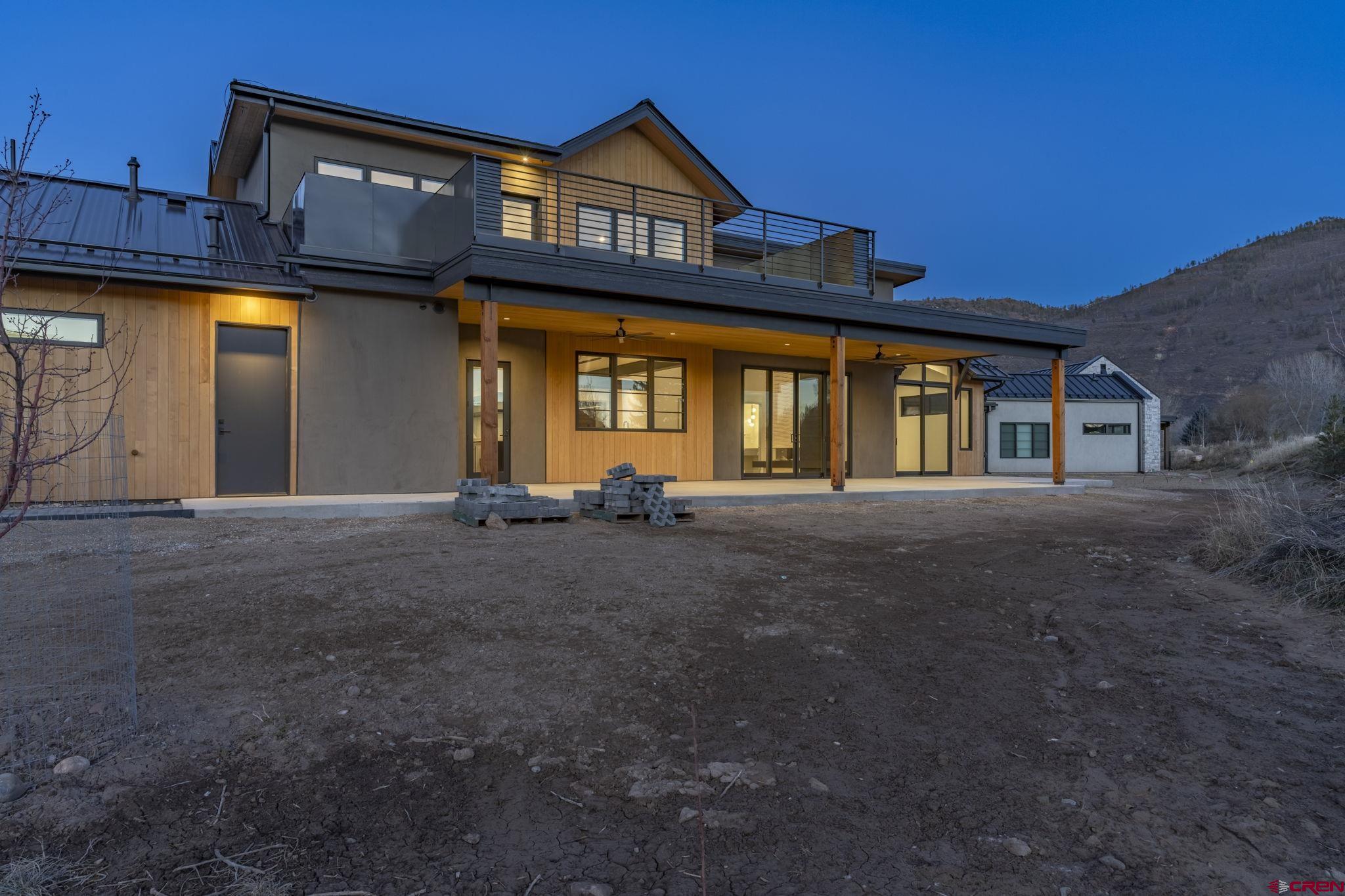 102 Elkview Court Durango, CO 81301 - Photo 6 of 45 a front view of a house with a yard