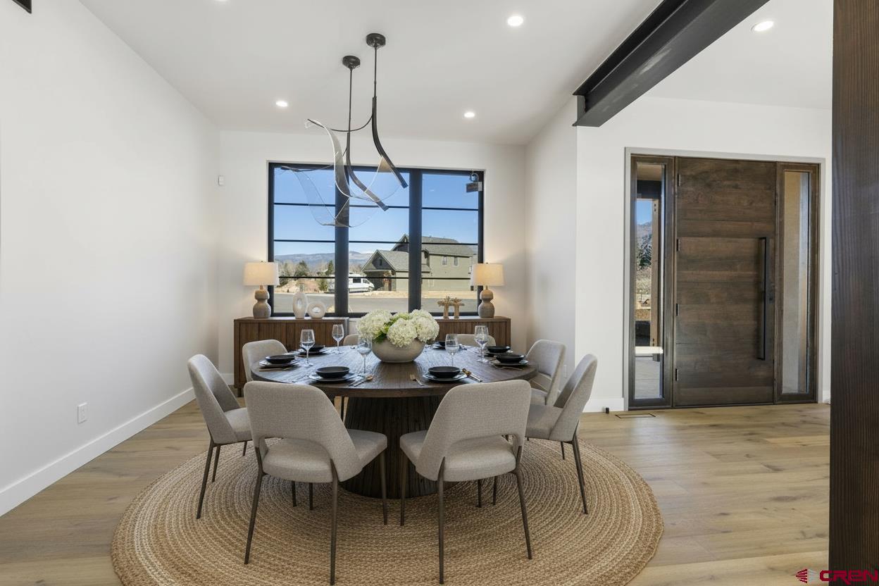 102 Elkview Court Durango, CO 81301 - Photo 8 of 45 a view of a dining room with furniture window and wooden floor