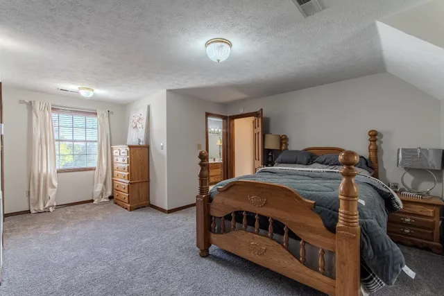 a view of a livingroom with furniture and a ceiling fan