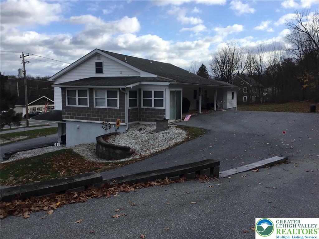 7954 Highway 873 Slatington, PA 18080 - Photo 15 of 26 a front view of a house with a garden
