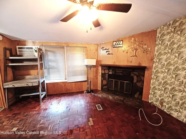a view of kitchen and hall with wooden floor