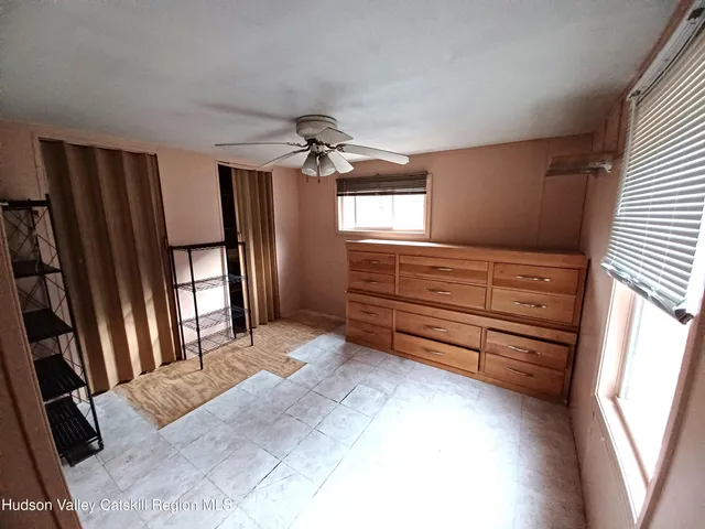 a view of room with window and stairs