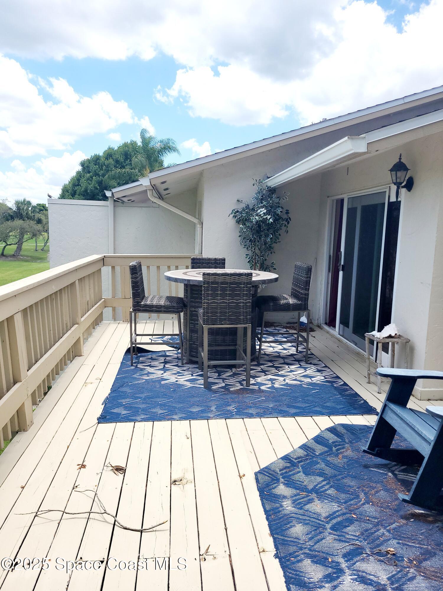 145 Augusta Way Melbourne, FL 32940 - Photo 26 of 28 a view of balcony and deck