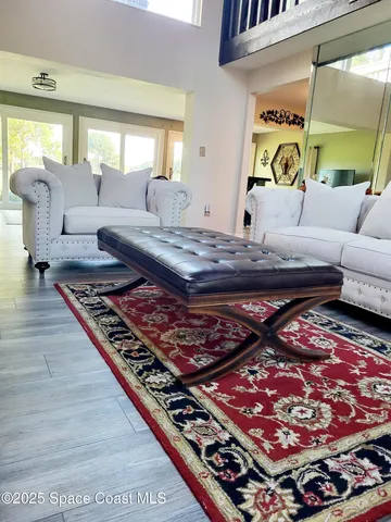 a living room with furniture and a rug