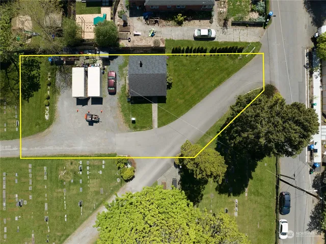 a aerial view of a house with a yard