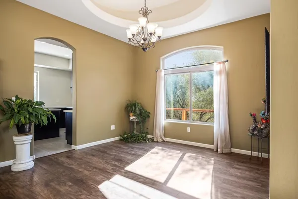 a view of an entryway with wooden floor