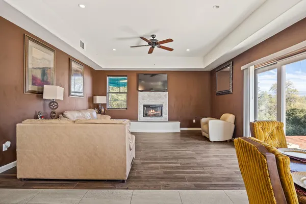 a living room with a fireplace and a fireplace