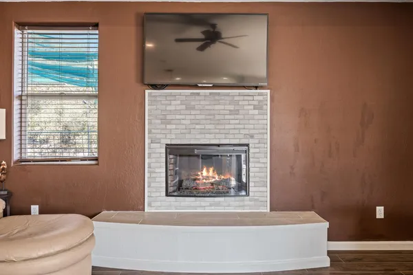 a living room with furniture or couch and a ceiling fan