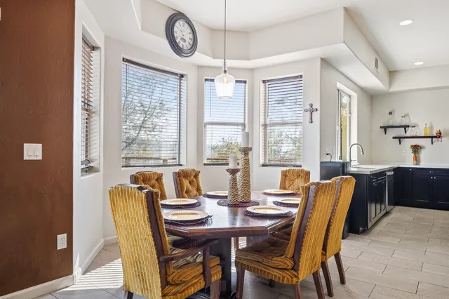 a dining room with furniture and window