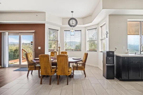 a kitchen with stainless steel appliances granite countertop a sink refrigerator and cabinets