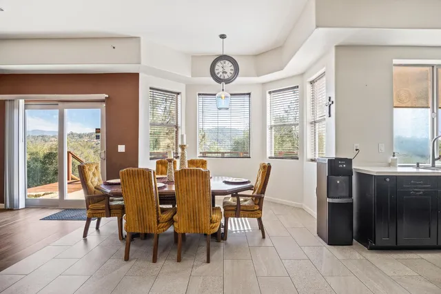 a kitchen with stainless steel appliances granite countertop a sink refrigerator and cabinets