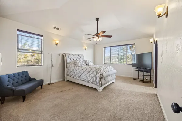 a bed room with a bed and a window