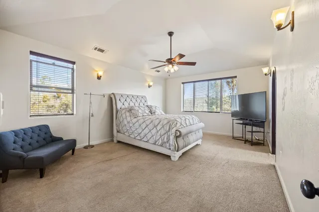 a bed room with a bed and a window