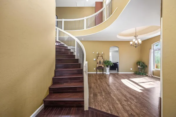 a view of an entryway with wooden floor