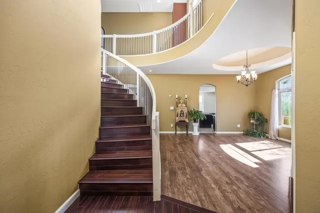 a view of an entryway with wooden floor