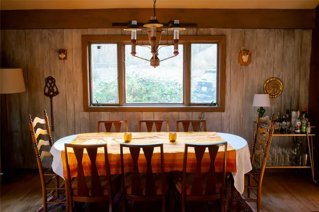 a dining room with furniture and window