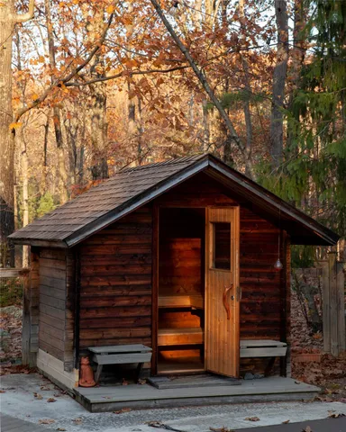 a view of wooden house with a large window