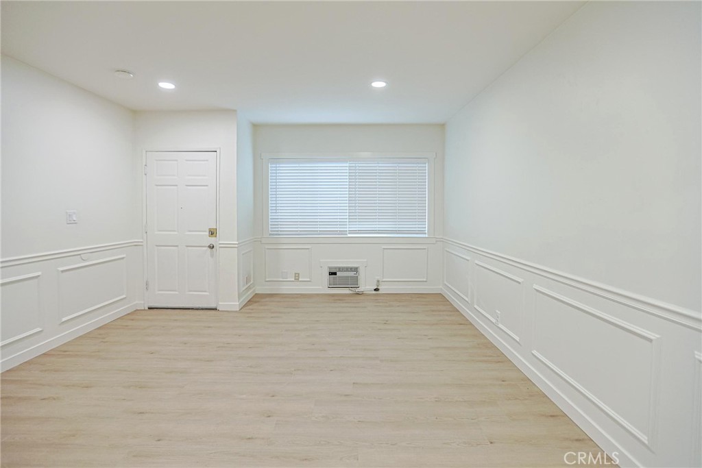 4109 West 5th Street, Unit F2 Santa Ana, CA 92703 - Photo 12 of 41 a view of empty room with wooden floor and fan