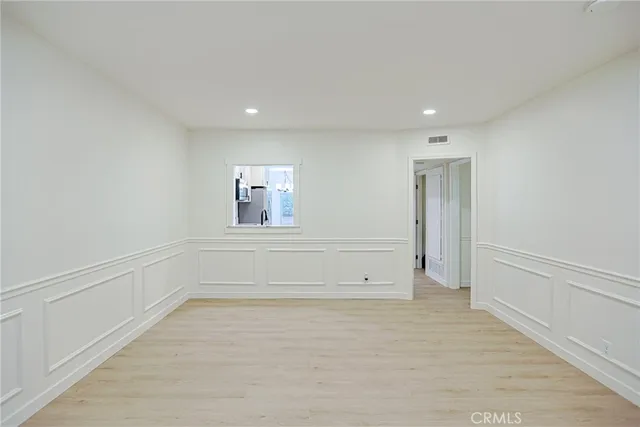 a kitchen with stainless steel appliances granite countertop a stove a refrigerator and a microwave