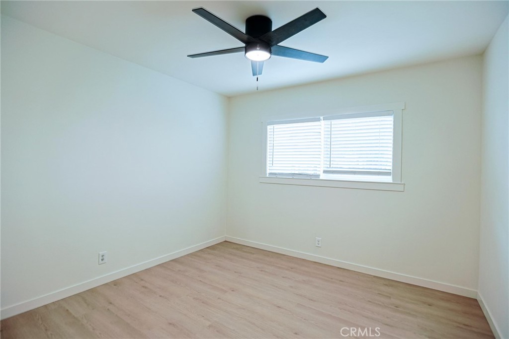4109 West 5th Street, Unit F2 Santa Ana, CA 92703 - Photo 31 of 41 an empty room with a window and a fan