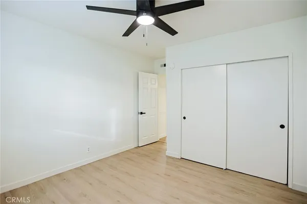 a view of hallway with a bathroom