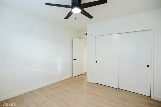 a view of hallway with a bathroom