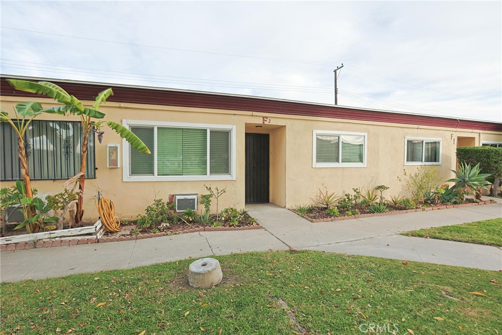 4109 West 5th Street, Unit F2 Santa Ana, CA 92703 - Photo 5 of 41 a front view of a house with garden